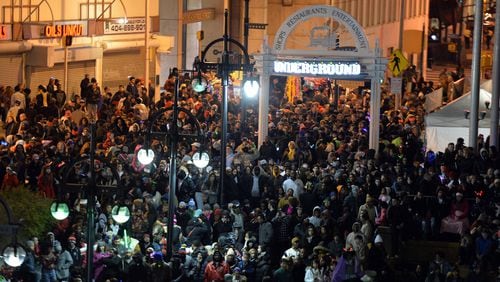 The crowd begins to build early night to get their spots at Underground Atlanta for Peach Drop 2014 in downtown Atlanta on Wednesday, December 31, 2014. HYOSUB SHIN / HSHIN@AJC.COM