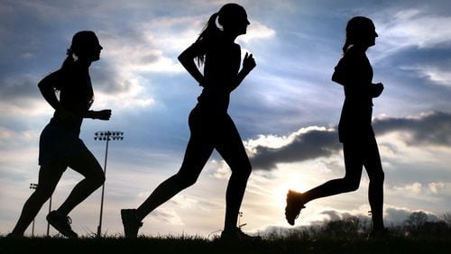 PRACTICE RUN--Millbrook High School girl's cross-country runners Nadia Dahimene, right, Hannah Croyle, center, and Mellany Groll practice for the postseason at the school in Frederick County, Va., Wednesday, Nov. 11, 2015. All three are previous state qualifiers. (Jeff Taylor/The Winchester Star via AP)