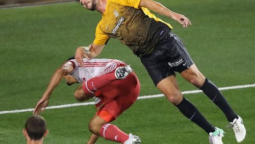 Atlanta United defender Miles Robinson collides with Charleston Battery defender Rorrest Lasso in the Lamar Hunt U.S. Open Cup fourth round at 5th Third Bank Stadium on Wednesday, June 14, 2017, in Kennesaw. Curtis Compton/ccompton@ajc.com