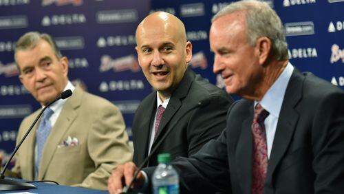 Braves president of baseball operations John Hart (right) and vice chairman John Schuerholz (left) flank former general manager John Coppolella at the October 2015 news conference to announce Coppolella’s promotion to GM. He was forced to resign two years later. (Hyosub Shin/hshin@ajc.com)