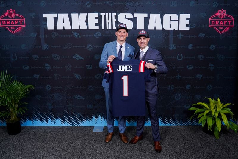 Dan Everett (R) of Everett Sports Marketing poses with client Mac Jones after the former Alabama quarterback was selected in this year's NFL draft. (Photo by Cooper Neill/NFL)