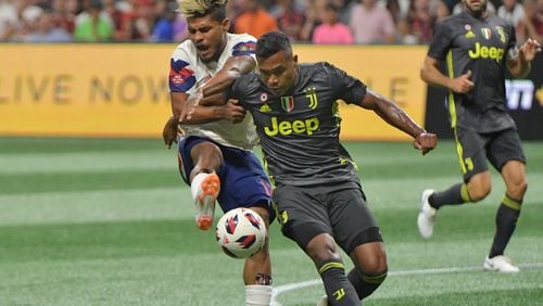 August 1, 2018 Atlanta - MLS All-Stars forward Josef Martinez (17) battles Juventus defender Alex Sandro (12) for the ball in the first half of the Major League Soccer All-Star Game at the Mercedes-Benz Stadium on Wednesday, August 1, 2018. HYOSUB SHIN / HSHIN@AJC.COM