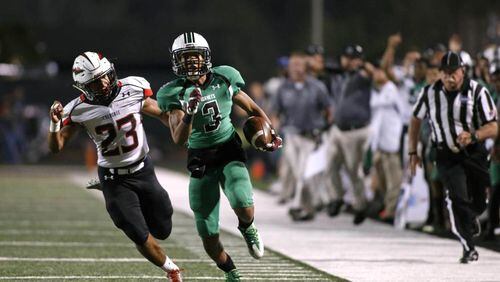 November 4, 2016 - Roswell, Ga: Roswell wide receiver Christian Ford (3) runs down the sideline against Cherokee linebacker Mckinley Hunter (23) in the first half of their game at Roswell High School Friday November 4, 2016, in Roswell, Ga. The winner is the Region 4-AAAAAAA champion. PHOTO / JASON GETZ