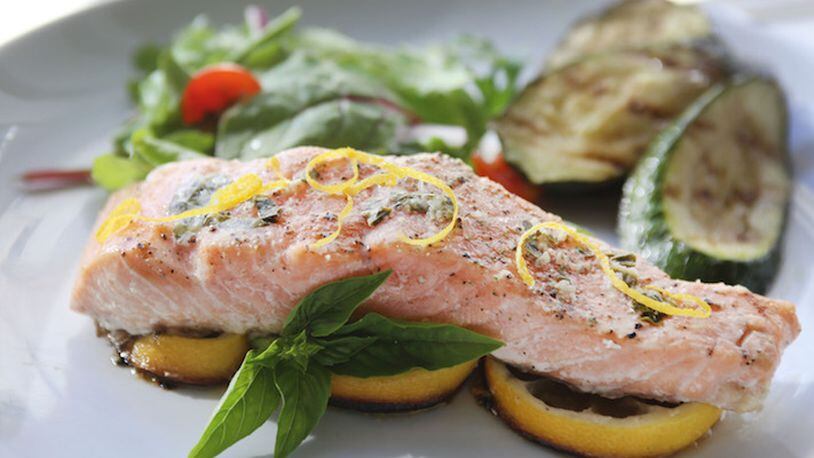 Grilled citrus salmon with Basil Butter. (Regina H. Boone/Detroit Free Press/TNS)