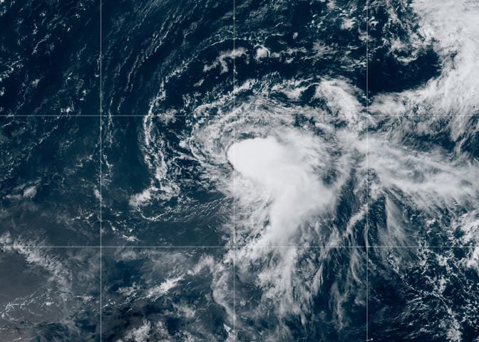 In a satellite photo from the National Oceanic and Atmospheric Administration, Tropical Storm Julian in the Atlantic, Aug. 29, 2021. (NOAA via The New York Times)