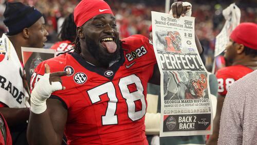 Georgia defensive lineman Nazir Stackhouse celebrates in the closing minutes of the Bulldogs' win against TCU in the 2023 College Football Playoff National Championship game. (Jason Getz file photo / Jason.Getz@ajc.com)