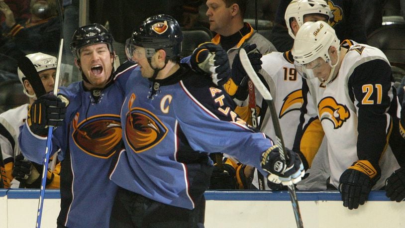 Eric Boulton #36 celebrates with Ilya Kovalchuk (17) after he made the game winning goal in  overtime during the Atlanta Thrashers game against the Buffalo Sabres on Wednesday, April 1, 2009 as  Sabres  Drew Stafford (21)  holds his head down in the background. JOHNNY CRAWFORD/ jcrawford@ajc.com