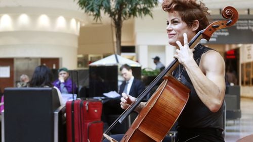Cellist Jenn Cornell performs in the Atrium of Hartsfield-Jackson International Airport (BOB ANDRES)