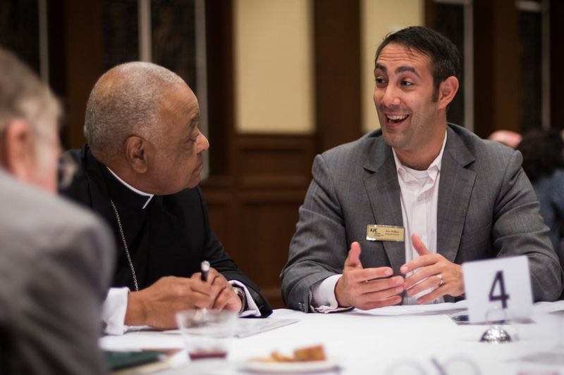 Dov Wilker (right) talks with former Atlanta Archbishop Wilton Gregory, ., during the Fourth Annual Nostra Aetate Catholic-Jewish program. CONTRIBUTED BY JACOB ROSS