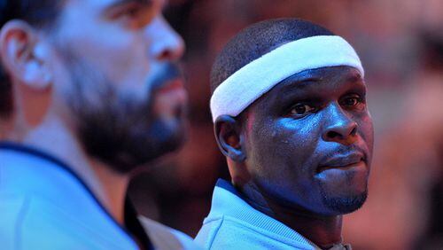 Memphis Grizzlies center Marc Gasol, left, and forward Zach Randolph stand on the court during the singing of the National Anthem before an NBA basketball game against the Portland Trail Blazers Friday, Nov. 13, 2015, in Memphis, Tenn. (AP Photo/Brandon Dill)