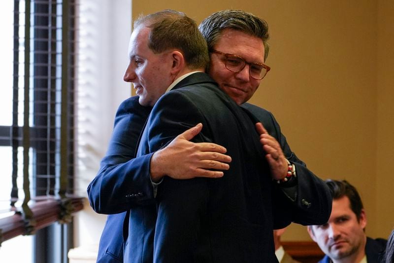 Covenant School parent Brent Leather, right, hugs attorney Eric Osborne, left, before a hearing to decide whether the journals of a Nashville school shooter can be released to the public, Tuesday, April 16, 2024, in Nashville, Tenn. (AP Photo/George Walker IV)