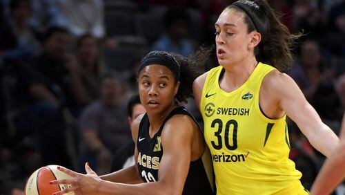 Nia Coffey(#12) of the Las Vegas Aces drives against Breanna Stewart of the Seattle Storm during the Aces' inaugural regular-season home opener at the Mandalay Bay Events Center on May 27, 2018 in Las Vegas, Nevada. (Photo by Ethan Miller/Getty Images)