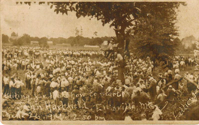 From the National Center for Civil and Human Rights' "Without Sanctuary Collection" on lynching and anti-lynching. This postcard shows the crowd gathered for the lynching of John Hartsfield in Ellisville, Mississippi, June 26, 1919.