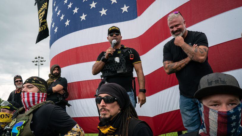 FILE — Enrique Tarrio, then-leader of the Proud Boys, speaks at a rally in Portland, Ore., on Sept. 26, 2020. Tarrio has been charged with conspiring with other top lieutenants of the far-right nationalist group to attack the Capitol last year, according to an indictment set to be released on Tuesday, March 8, 2022, by federal prosecutors. (Diana Zeyneb Alhindawi/The New York Times)