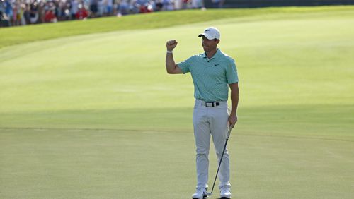 Rory McIlroy reacts after winning the Tour Championship on the 18th green during the final round at East Lake Golf Club, Sunday, Aug. 28, 2022, in Atlanta. (Jason Getz / Jason.Getz@ajc.com)