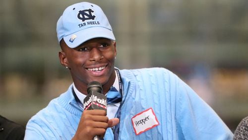 Tyrone Hopper, from Roswell, is decked out in Carolina blue on his way to the Tar Heels during national signing day  Wednesday, Feb, 3, 2016, in Atlanta.