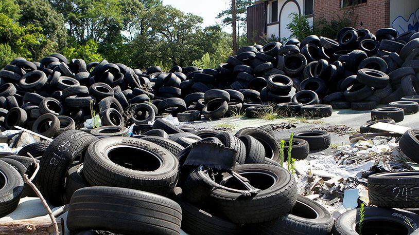 A file photo of scrap tires is shown. Georgia utility regulators recently changed the definition of approved fuels that can be burned at biomass plants to include crap tires. PHIL SKINNER / PSKINNER@AJC.COM