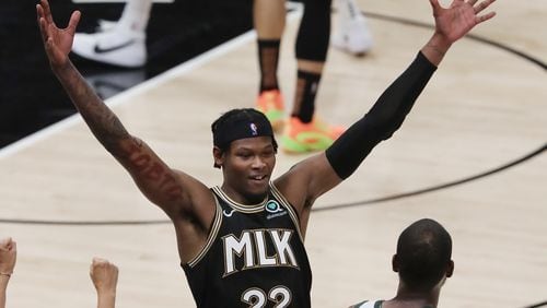 Hawks guard Cam Reddish forces Milwaukee Bucks forward Khris Middleton to lose the ball out of bounds but maintain the possession during the second quarter in Game 4 of the NBA Eastern Conference Finals on Tuesday, June 29, 2021, in Atlanta.  Curtis Compton / Curtis.Compton@ajc.com