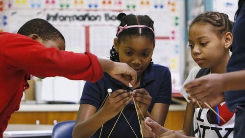 Brian Moore (from left), Noa Walker and Za’Riyah Jones build a bridge out of spaghetti and marshmallows, part of an experiment for a class segment on types of bridges at Chapel Hill Elementary School in DeKalb County. In 2006, Georgia education officials touted the growing numbers of minority and disadvantaged students flowing into gifted classes. But an analysis by The Atlanta Journal-Constitution shows black students still lag significantly behind their white counterparts in gifted programs. And the gap is wide when it comes to poor students. BOB ANDRES / BANDRES@AJC.COM