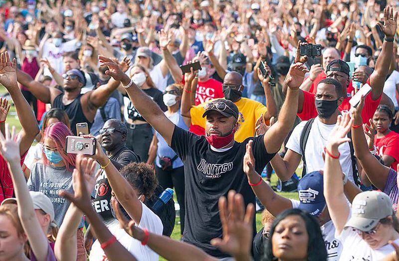 A large crowd gathers at the Centennial Olympic Park stage for an OneRace prayer and worship before marching to the State capital Friday, June 19, 2020.  STEVE SCHAEFER FOR THE ATLANTA JOURNAL-CONSTITUTION
