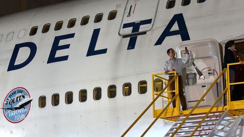 December 19, 2017 Atlanta - A guest takes a selfie after a tour of Delta 747 during a 747 hangar party Tuesday night at Delta TechOps on Tuesday, December 19, 2017. The Atlanta-based airline now plans to operate the final commercial flight of the 747 jumbo jet on Tuesday Dec. 19, from Seoul to Detroit, two days later than previously planned. Hyosub Shin / hshin@ajc.com