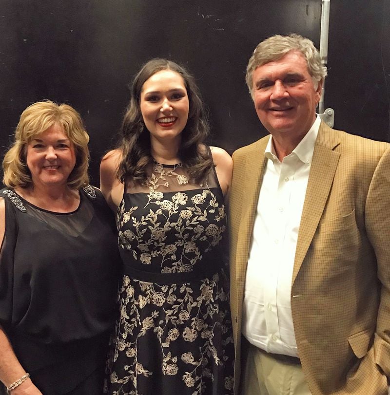 Kaitlyn Johnson poses with her parents, Susan and Paul, after her professional debut with the Atlanta Opera. (Courtesy Kaitlyn Johnson)