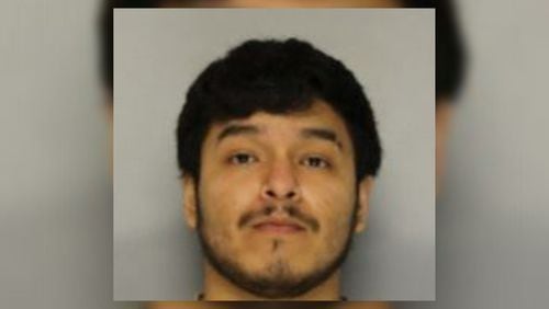 Steve Joe Andrade, 26, was charged with murder in the death of his 52-year-old father, Esteban Andrade, whose body was found Tuesday behind a Hall County home.