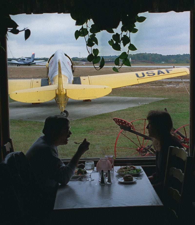  Eat at the 57th Fighter Group Restaurant and get a view of one of the vintage aircrafts on the grounds of the restaurant, and of airplanes on the runways of DeKalb-Peachtree Airport./Photo credit: Charlotte B. Teagle.