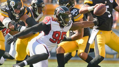 Atlanta Falcons defensive end Takkarist McKinley (98) reaches for Pittsburgh Steelers quarterback Joshua Dobbs (5) in their exhibition game, Sunday, Aug. 20, 2017, in Pittsburgh. (AP Photo/Don Wright)