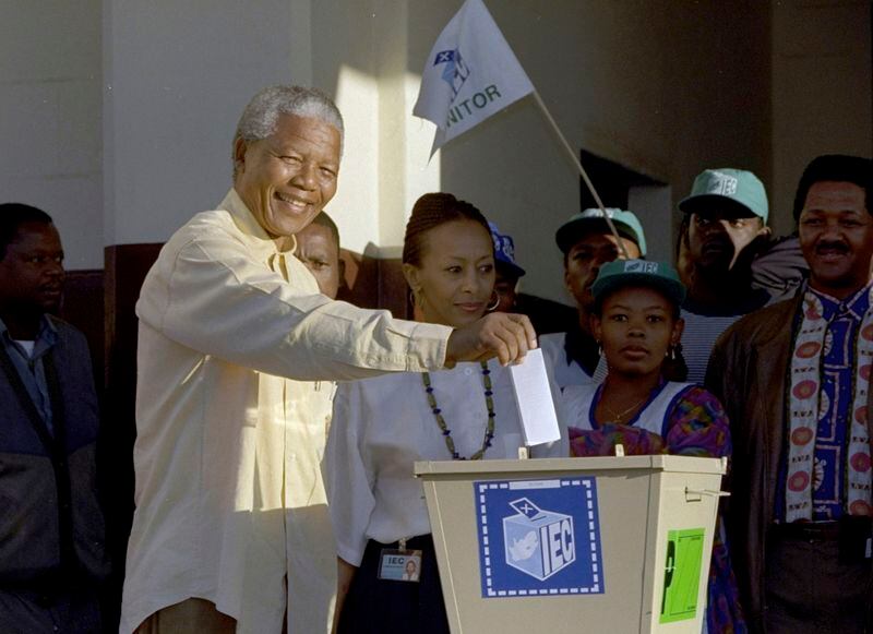 FILE - Then African National Congress leader, Nelson Mandela casts his vote April 27, 1994 near Durban, South Africa, in the country's first all-race elections. In 1994 people braved long queues to cast votes after years of white minority rule which denied Black South Africans the right to vote. (AP Photo/John Parkin. File)