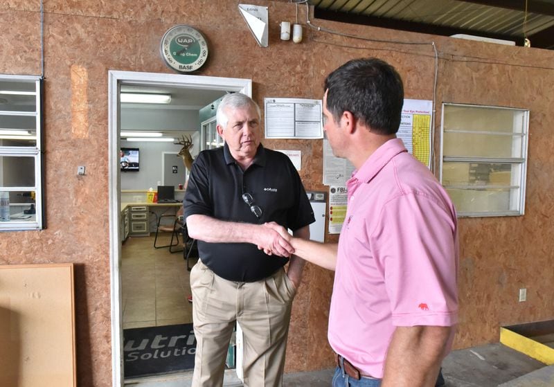April 9, 2019 Arlington - Hank Jester (left), owner/agent of Cornerstone Insurance Group, greets Eric Kimbrel, branch manager, with handshakes as Jester visits for his farmer clients at Nutrien Ag Solutions in Arlington on Tuesday, April 9, 2019. Mr. Hank Jester is a banker, insurer and a farmer is Blakely, Ga. Congress' delay in finalizing an aid package for Hurricane Michael victims has had a real impact on the ground in Georgia. HYOSUB SHIN / HSHIN@AJC.COM