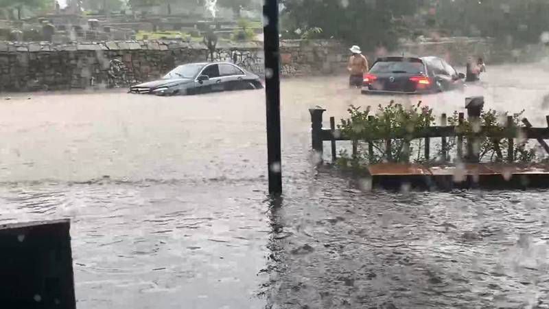Streets flooded in Atlanta's Cabbagetown neighborhood on Friday afternoon as storms moved through metro Atlanta.