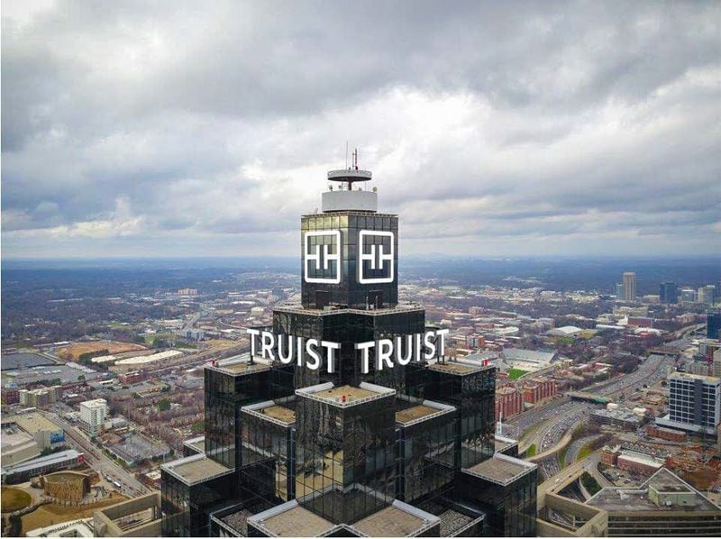 Truist wants its name and logo in lights atop the city's second-tallest building, like in this rendering that was filed with city building inspectors. It's part of their phase-out of the SunTrust brand.