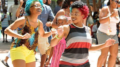 Ka'ia and De'ja (only names given) dance to the beat at the 11th Annual Juneteenth Cultural Festival, hosted by the Cobb County Branch of the NAACP. (PHOTO M. CHRIS HUNT)