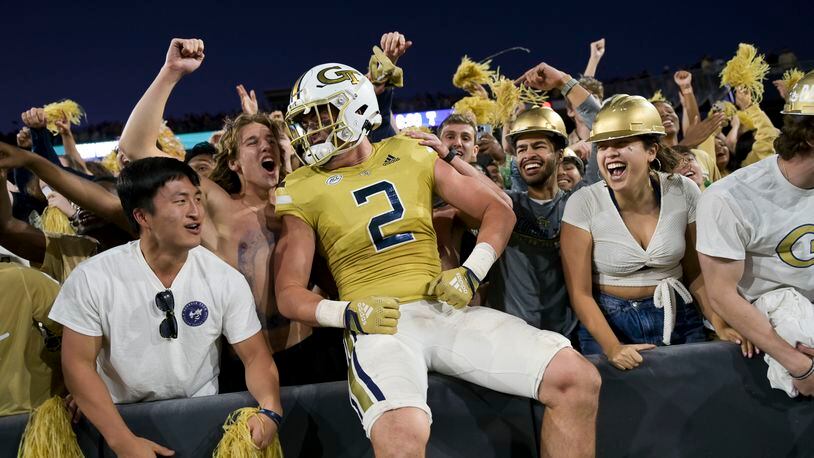 Georgia Tech’s Dylan Leonard celebrates with fans after defeating Duke 23-20 in overtime Oct. 8 at Bobby Dodd Stadium. In an attempt to spur ticket sales and revive attendance, Georgia Tech has dropped the per-game cost of season tickets on 94% of the seats in the 55,000-seat stadium and held the line for the remaining 6%. (Daniel Varnado / for The Atlanta Journal-Constitution)