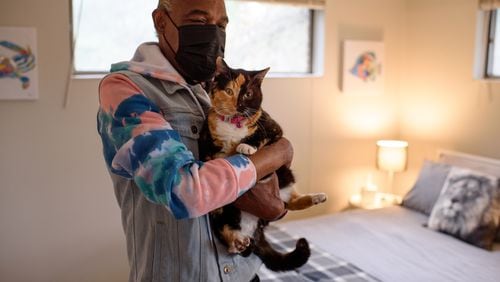 Tracey Hardin is pictured with his cat Patches. Hardin lived on the streets of Atlanta through consecutive winter seasons, in a pandemic and with asthma.  Photo Credit: David Murray Jr.