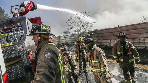 Fire crews battled a massive blaze at a northwest Atlanta salvage yard on Monday, Sept. 23, 2019, officials said.