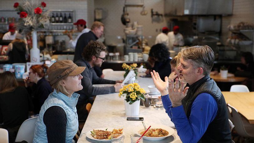 Kate Jackson and Michael Pilhofer sat at a communal table at Yum! Kitchen and Bakery in St. Louis Park, Minn. (Anthony Souffle/Minneapolis Star Tribune/TNS)