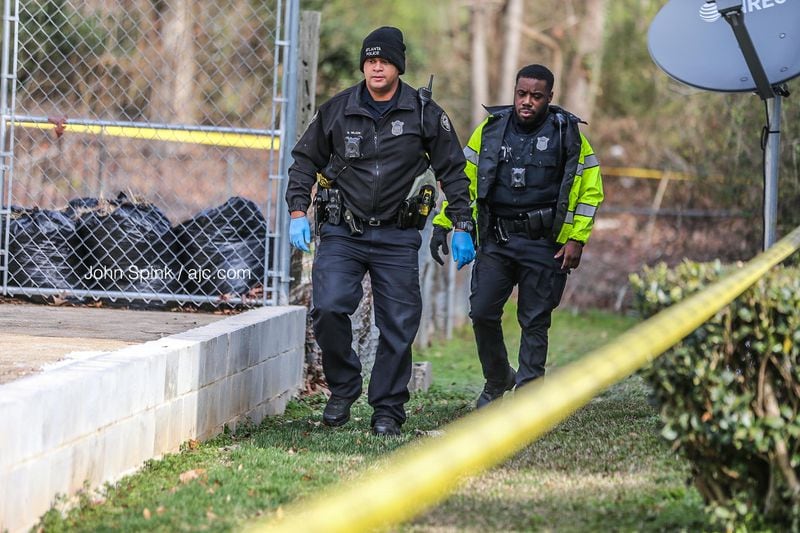 The Fulton County Medical Examiner was called to extract the man's body from under the fence.