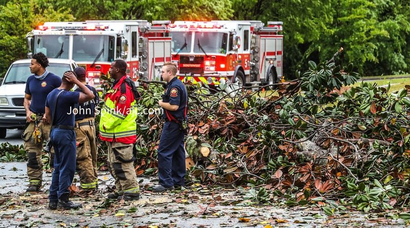 A fallen tree blocks Guilford Forest Drive at Jewel Court in southwest Atlanta.