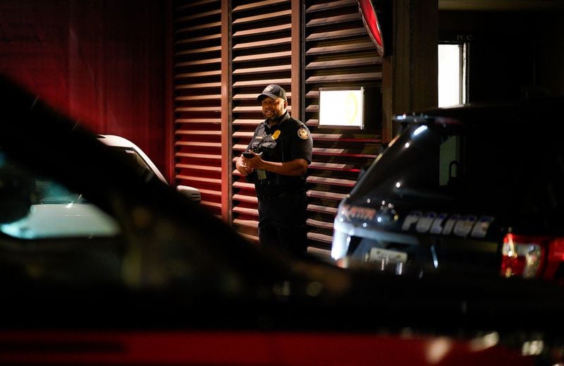 An Atlanta officer stands guard as the investigation of a fatal shooting at the Hyatt Regency gets underway Monday night.