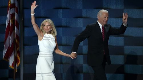 Former US Vice President Joe Biden and his wife Jill Biden, wave to the crowd after delivering remarks on the third day of the 2016 Democratic National Convention. (Photo by Alex Wong/Getty Images)