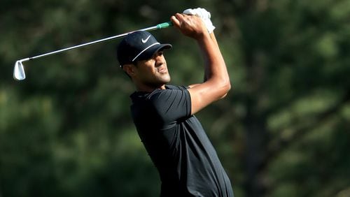Tony Finau plays his second shot on the 15th hole Thursday, having gone 15 holes farther than many thought possible.  (Andrew Redington/Getty Images)
