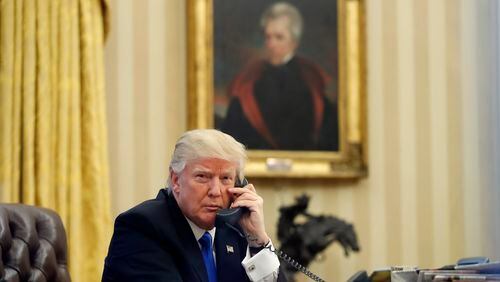 In this January file photo, President Donald Trump speaks on the telephone with Australian Prime Minister Malcolm Turnbull in the Oval Office of the White House in Washington. AP/Alex Brandon
