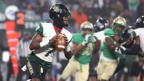 Langston Hughes quarterback Prentiss Noland looks to pass during the first half against Buford in the 2021 Class 6A state title football game. (JASON GETZ / FOR THE ATLANTA JOURNAL-CONSTITUTION)