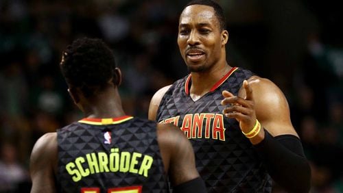 The Atlanta Hawks’ Dwight Howard talks with Dennis Schroder during the second quarter against the Boston Celtics at TD Garden on February 27, 2017 in Boston, Massachusetts. (Photo by Maddie Meyer/Getty Images)