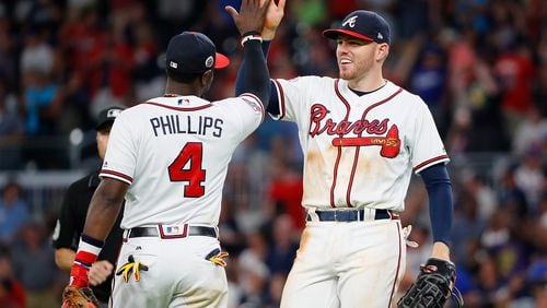 A meeting of noted Braves third basemen breaks out, post-game. (Kevin C. Cox/Getty Images)