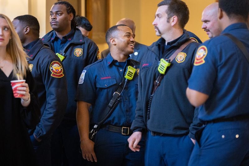 Firefighters wait to be recognized by the House of Representatives at the Georgia Capitol on Thursday.