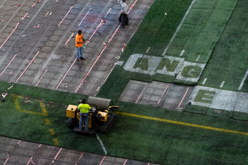 A scene of the artificial turf being removed at Mercedes-Benz Stadium on Thursday. (Photo by Dakota Williams/AMB Sports & Entertainment)