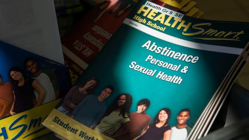 Comprehensive sexual and health education textbooks and learning materials are photographed on Wednesday, March 8, 2023, at Gwinnett County Schools Headquarters in Suwanee. The materials are being considered for use in Gwinnett County's sexual education curriculum. (Christina Matacotta for The Atlanta Journal-Constitution)